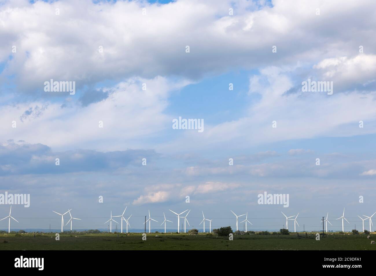 Wind turbines in the fields around Camber and Rye. Stock Photo
