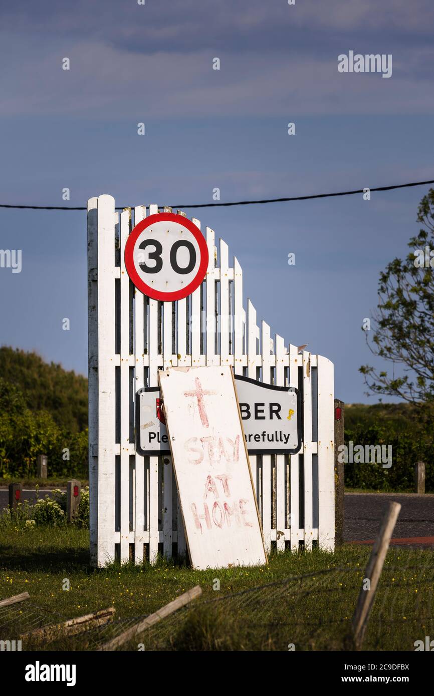 Home made signage telling visitors wanting to visit Camber Sands to stay at home. Stock Photo