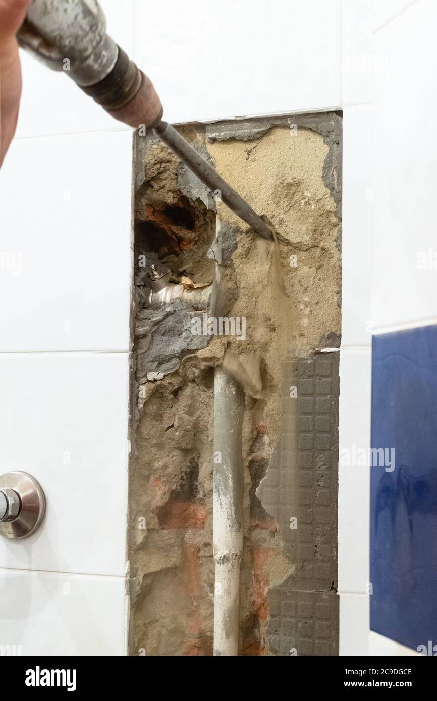 repairing of plumbing riser of heated towel rail at home cleaning a