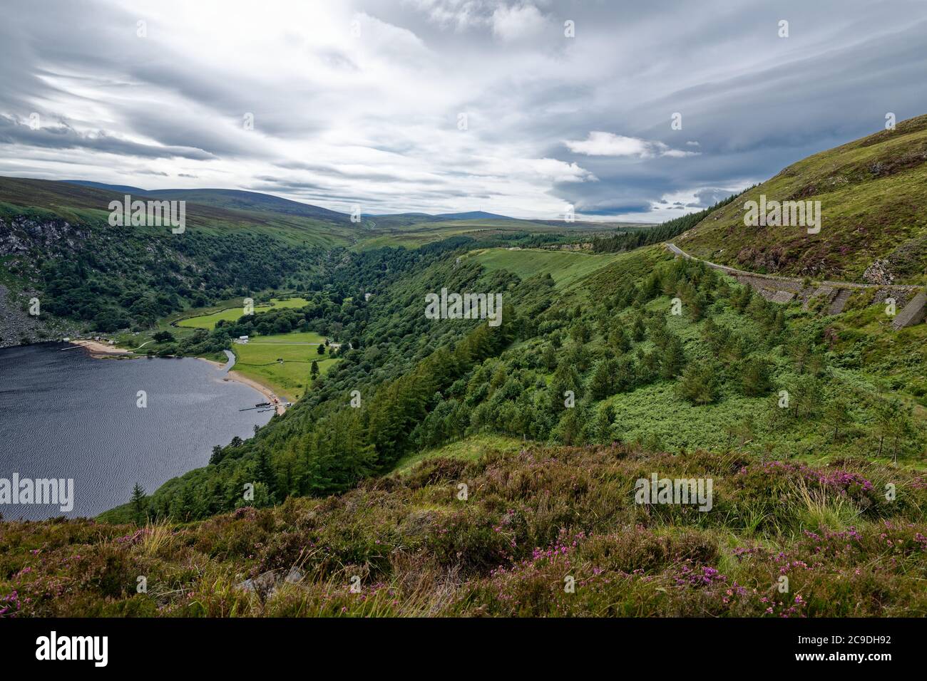 Lough Tay in Wicklow mounts.The place of filming early episodes Vikings series.The film attribute vikings drakkar boat still  moored at the lake shore Stock Photo