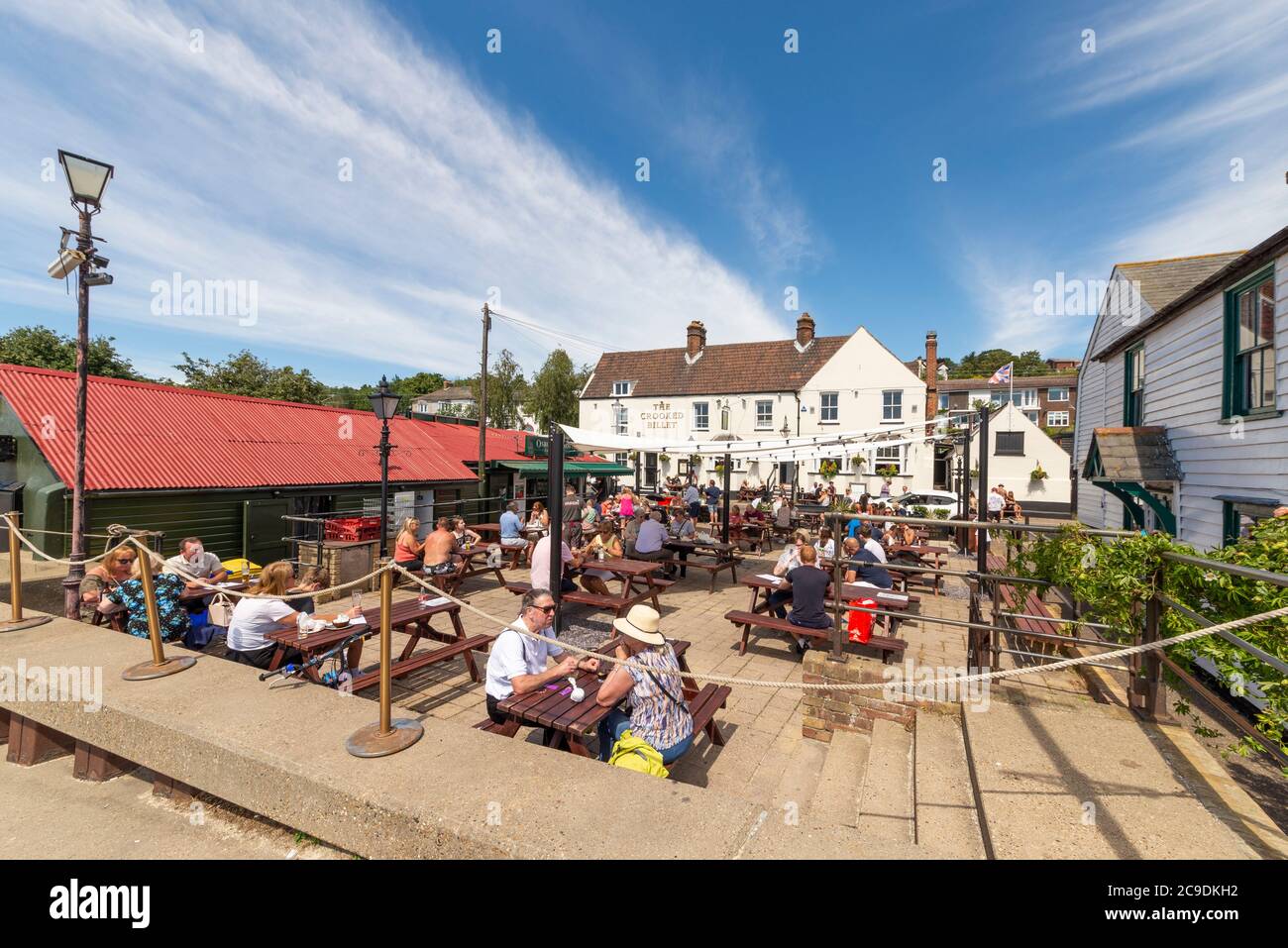 The Crooked Billet pub, with associated outdoor tables for customers outside on Billet Wharf. Busy with customers during COVID-19 Coronavirus lockdown Stock Photo