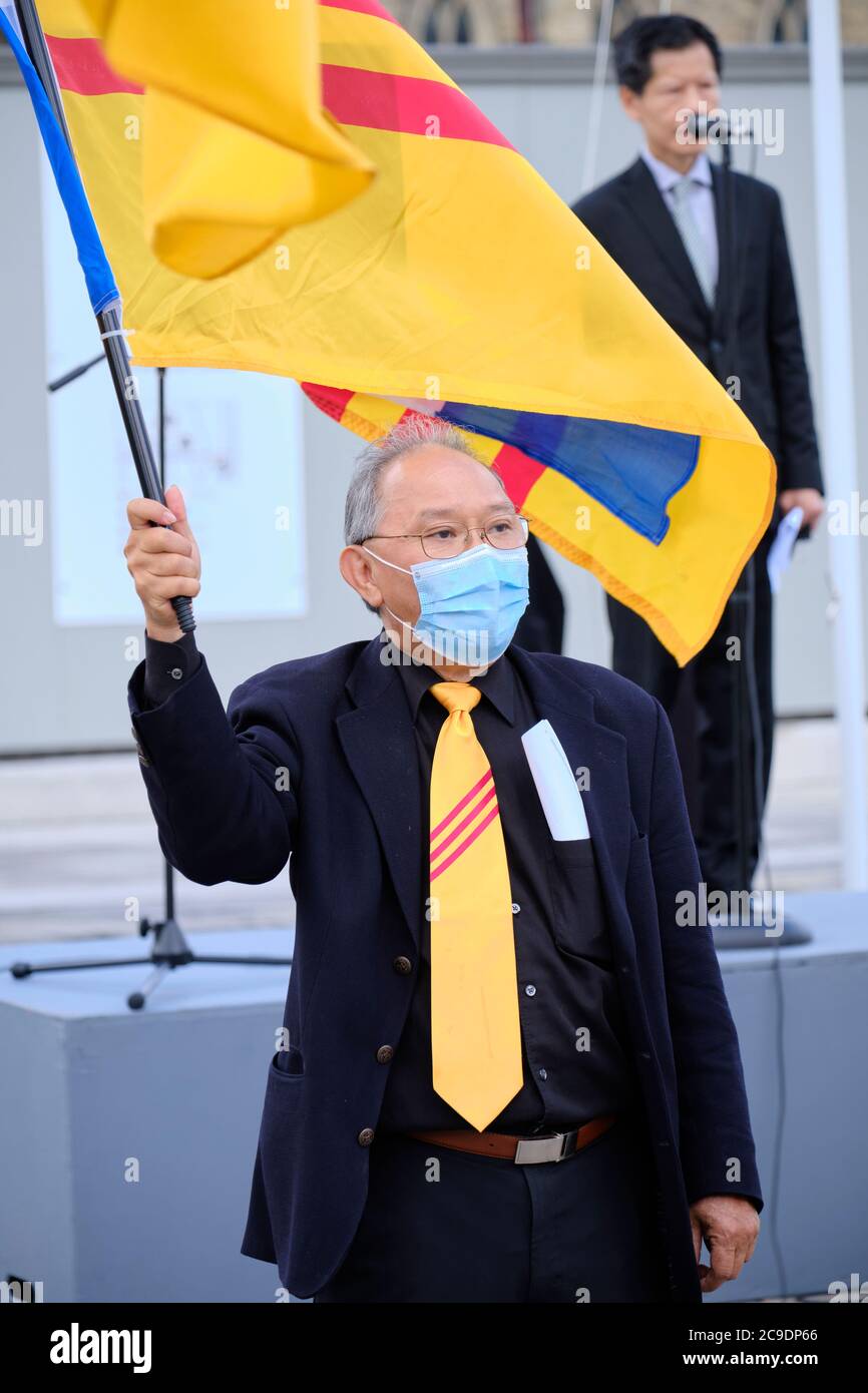 Vietnamese Canadians gathering in Ottawa,in honour of Journey to Freedom Day.  Raising of Vietnamese Freedom flag, participant wearing freedom scarves Stock Photo