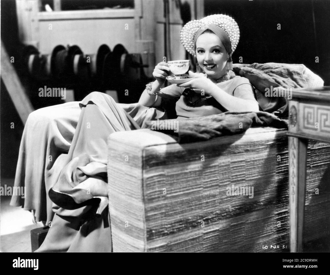 JESSIE MATTHEWS on set candid drinking cup of tea during break in filming IT'S LOVE AGAIN 1936 director VICTOR SAVILLE costumes Joe Strassner Gaumont British Picture Corporation Stock Photo