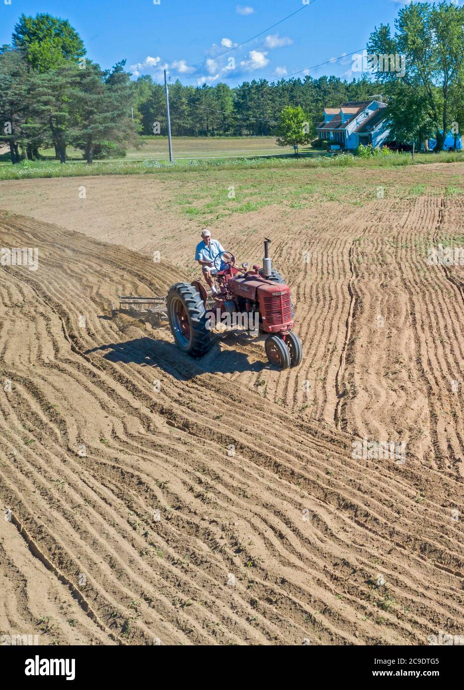 Tractor discing field hires stock photography and images Alamy