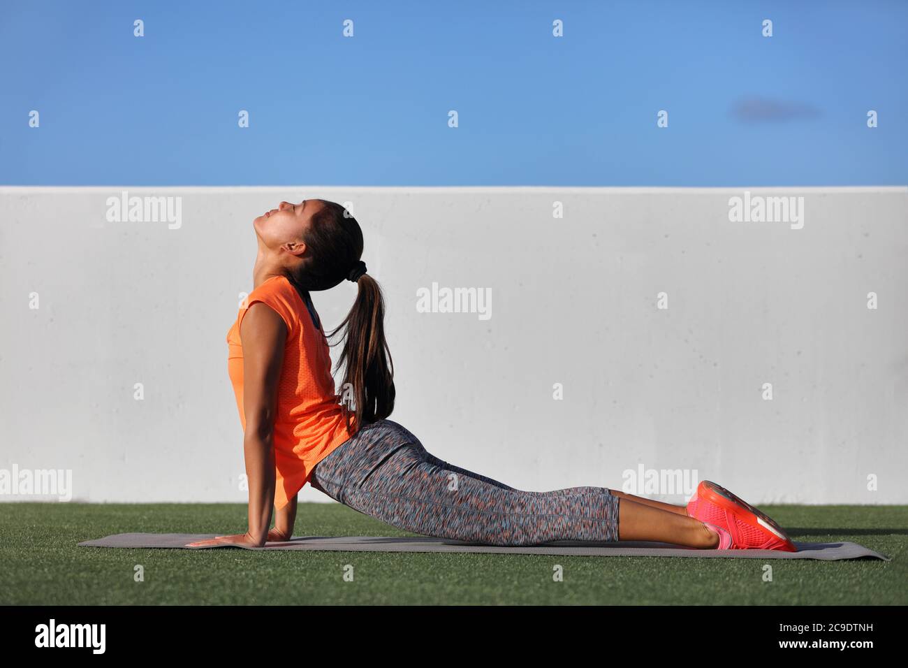 Girl doing bhujangasana cobra pose hi-res stock photography and images ...