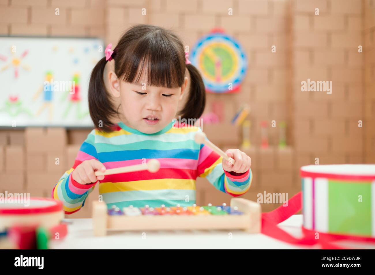 young girl play xylophone at home for homeschooling Stock Photo Alamy