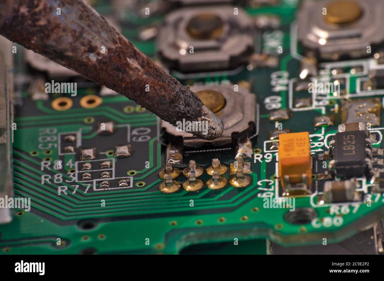 soldering iron on circuit board assembly. Electronic components Stock