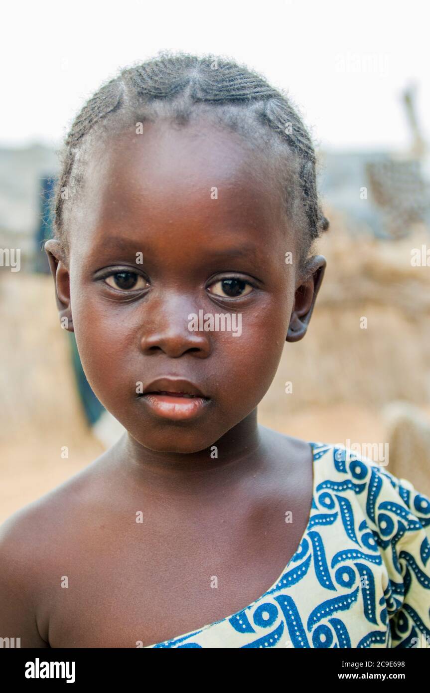 Portrait of a little girl in a street in Segou, a city in the center of ...