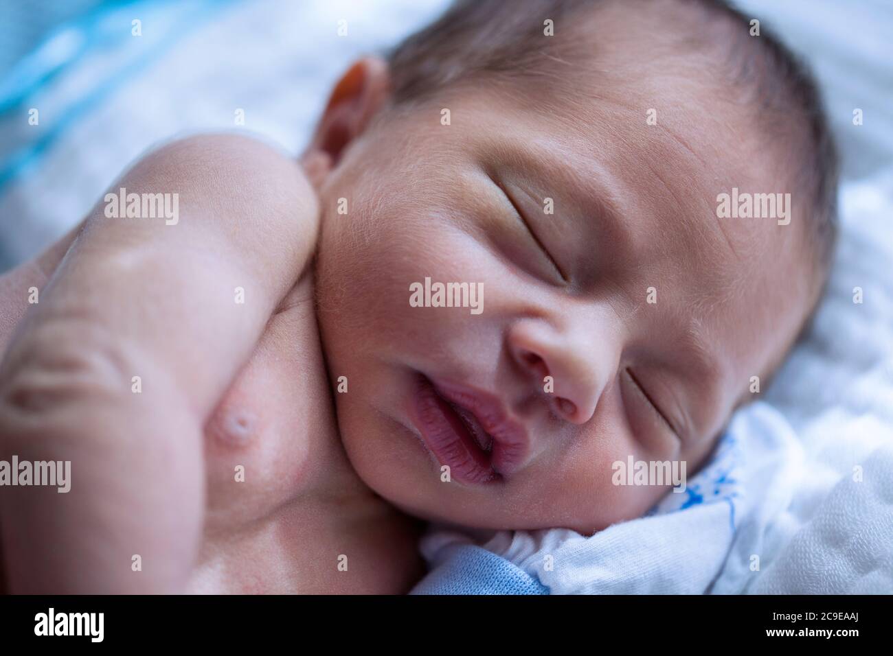 Shirtless newborn baby boy wearing white gloves sleeping Stock Photo Alamy