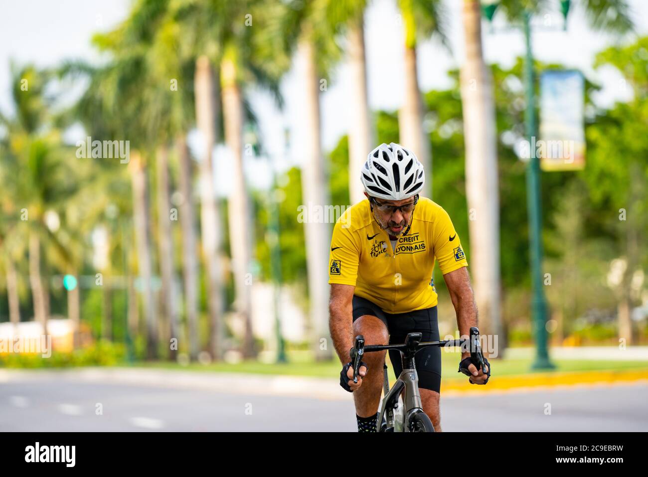 Photo of a man in his 60's riding a sports bicycle Stock Photo - Alamy