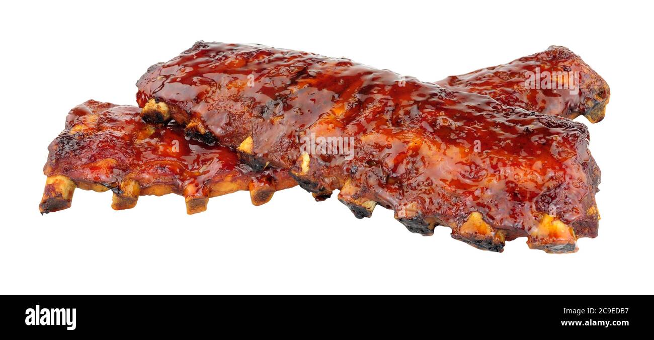 Chinese Peking style pork ribs coated with sticky plum sauce glaze isolated on a white background Stock Photo