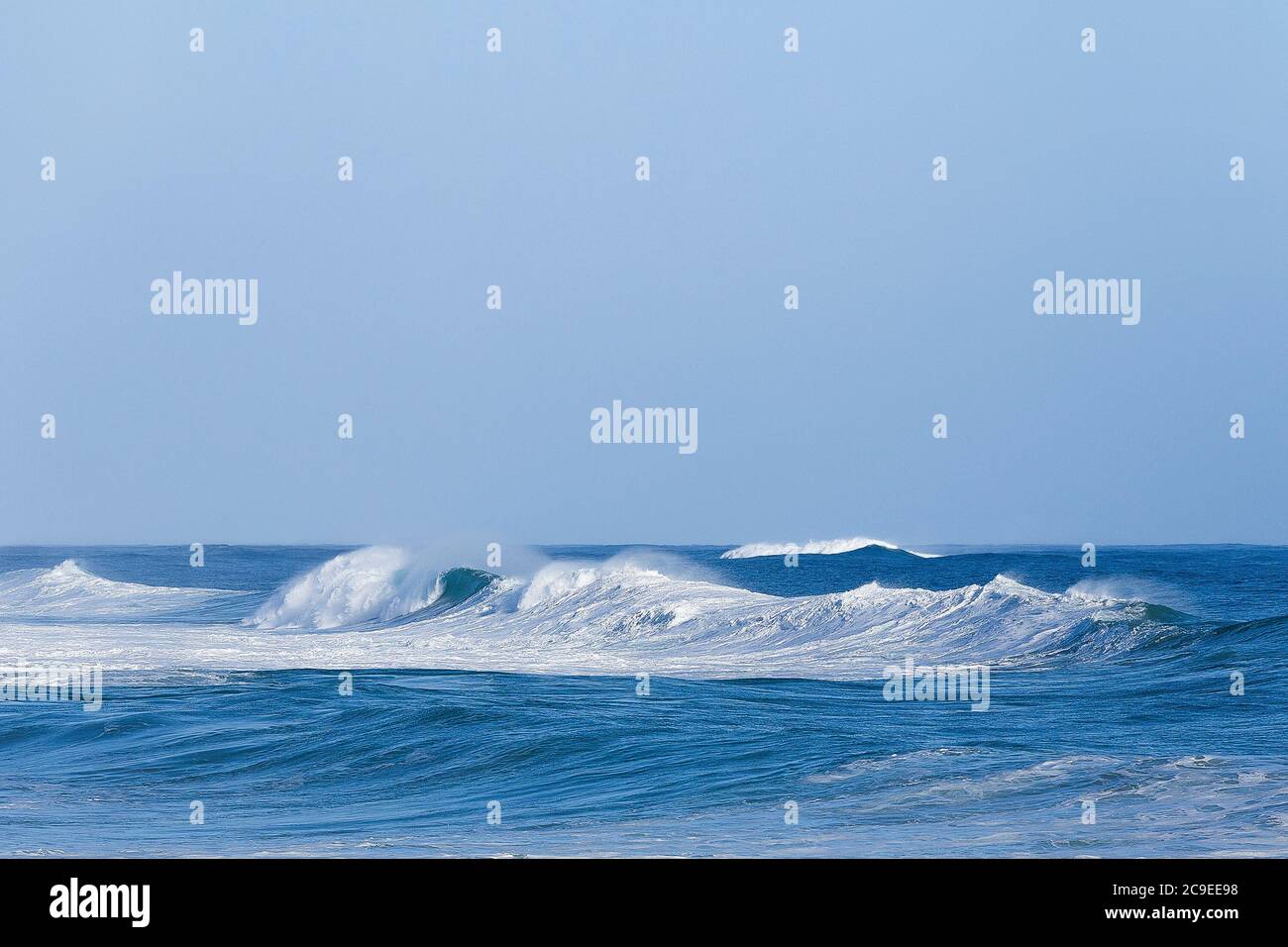 Crashing waves breaking on beach at Marengo Point in Apollo Bay Australia on a summer day Stock Photo