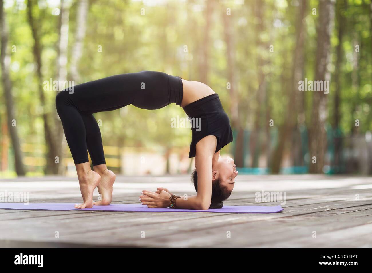 Woman doing Yoga Bridge pose