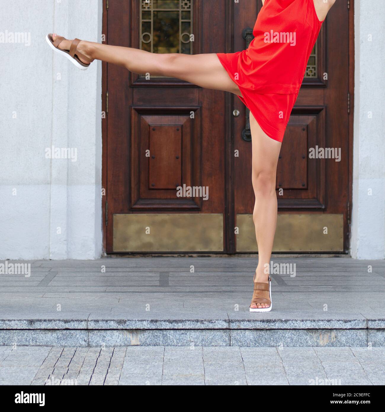 Close up slim woman legs. Street gymnastics. Stock Photo