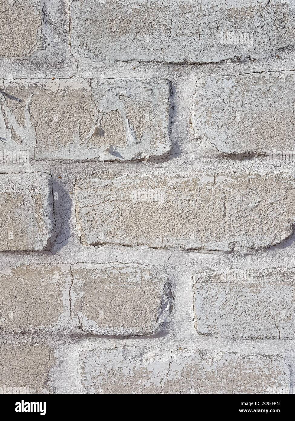 background grey brick wall with white seams close up Stock Photo