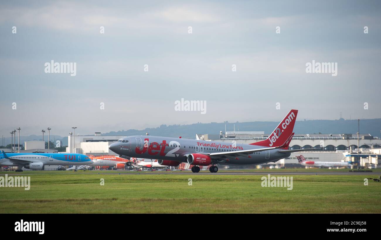 Glasgow, Scotland, UK. 31st July, 2020. Pictured: Jet2 flight LS119 /EXS96BL takes off for the Spanish island of Ibiza from Glasgow Airport. Jet2 announced earlier on this week that it was not flying passengers to Spain or its islands due to coronavirus cases reemerging. Todays flight looks like it is going out empty, perhaps to pick up returning holiday makers who will have to quarantine for 14 days when they return. Ironically today' s weather is forecast to be hotter in Glasgow than Hawaii. Credit: Colin Fisher/Alamy Live News Stock Photo
