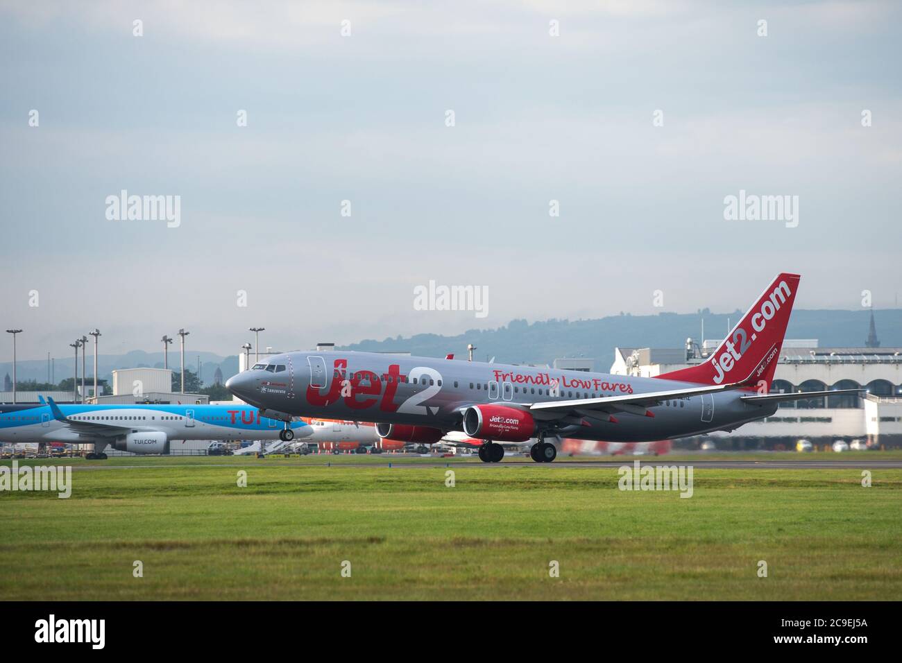 Glasgow, Scotland, UK. 31st July, 2020. Pictured: Jet2 flight LS119 /EXS96BL takes off for the Spanish island of Ibiza from Glasgow Airport. Jet2 announced earlier on this week that it was not flying passengers to Spain or its islands due to coronavirus cases reemerging. Todays flight looks like it is going out empty, perhaps to pick up returning holiday makers who will have to quarantine for 14 days when they return. Ironically today' s weather is forecast to be hotter in Glasgow than Hawaii. Credit: Colin Fisher/Alamy Live News Stock Photo