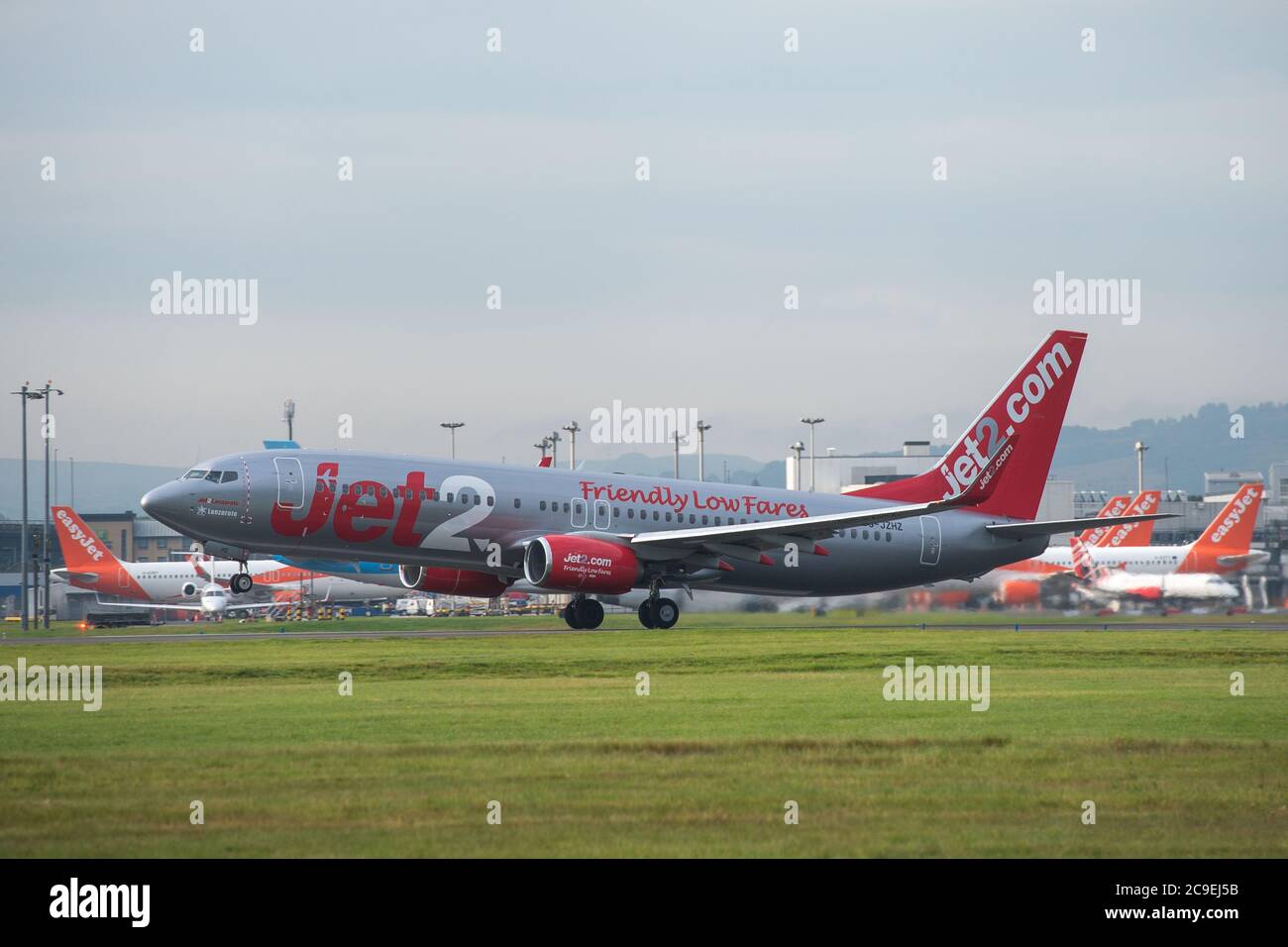Glasgow, Scotland, UK. 31st July, 2020. Pictured: Jet2 flight LS119 /EXS96BL takes off for the Spanish island of Ibiza from Glasgow Airport. Jet2 announced earlier on this week that it was not flying passengers to Spain or its islands due to coronavirus cases reemerging. Todays flight looks like it is going out empty, perhaps to pick up returning holiday makers who will have to quarantine for 14 days when they return. Ironically today' s weather is forecast to be hotter in Glasgow than Hawaii. Credit: Colin Fisher/Alamy Live News Stock Photo