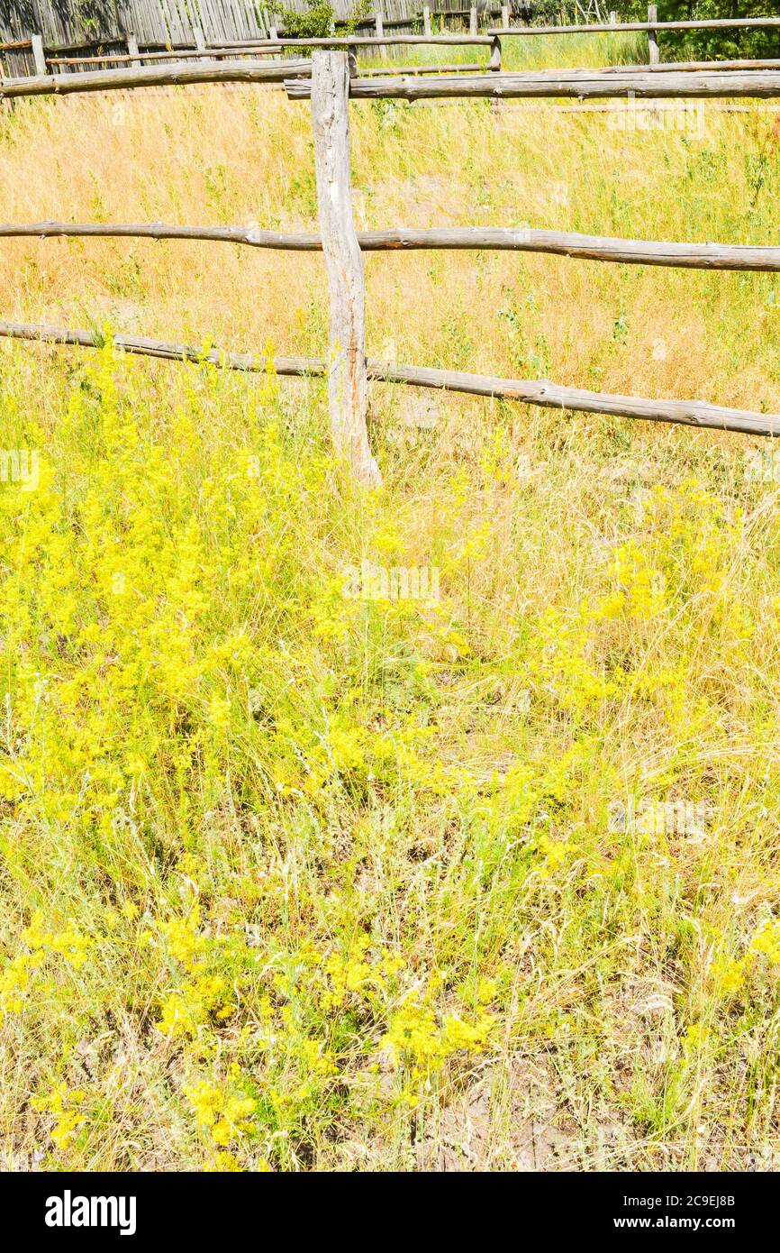 old wooden fence. Old fence on a background of grass Stock Photo - Alamy