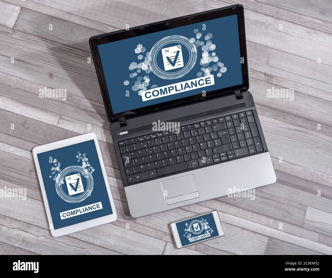 Compliance concept shown on different information technology devices Stock Photo