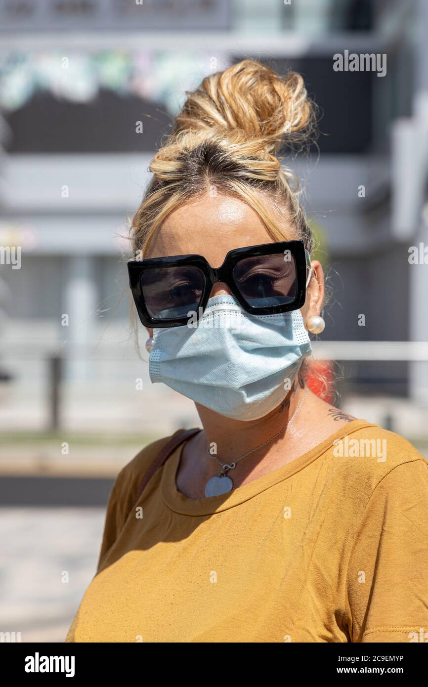 Young Woman Wearing Protection Face Mask And Sunglasses Against
