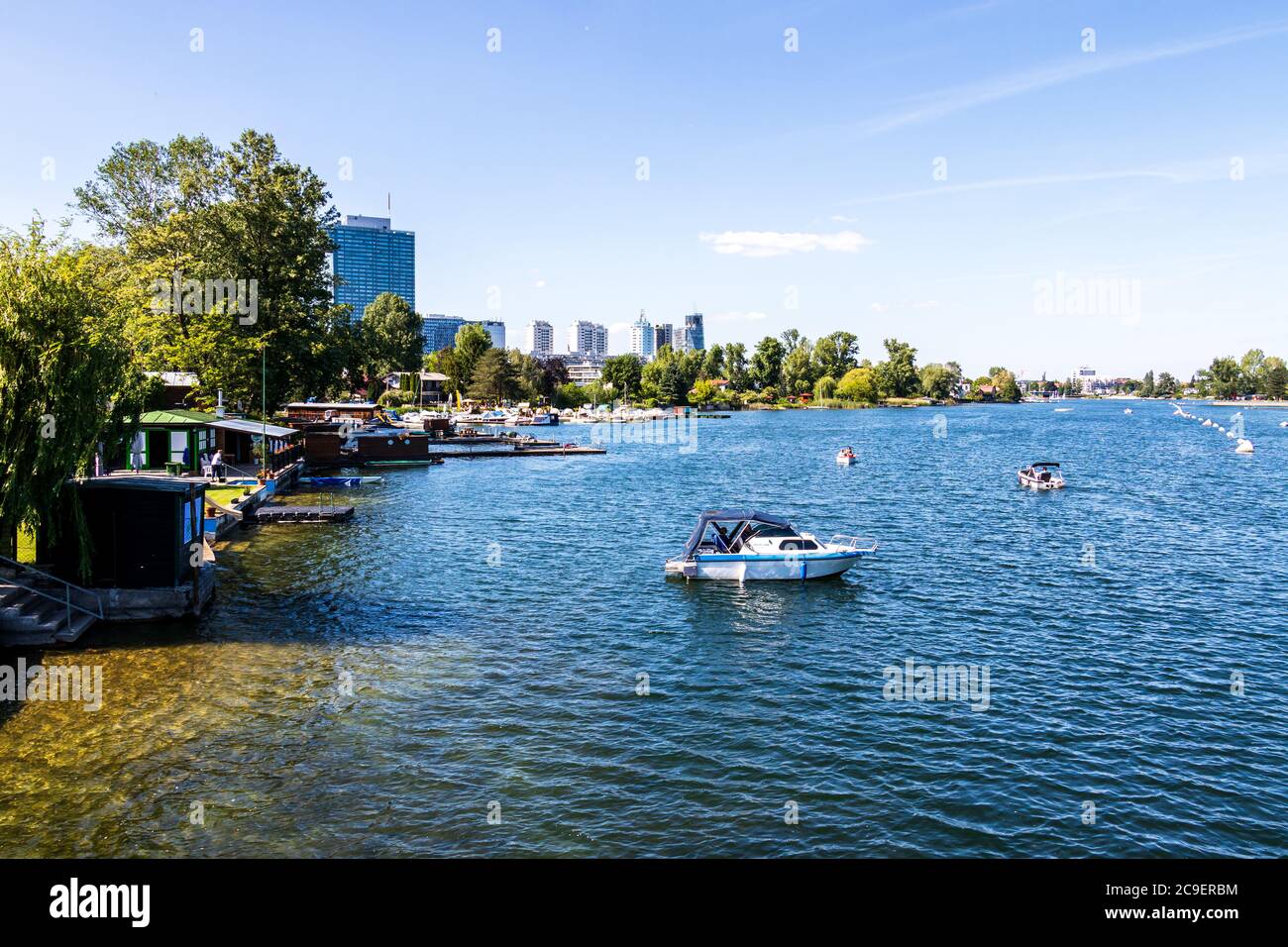 View on Old Danube River, ger. Alte Donau, with Boats, Landscape and Buildings in Vienna, Austria, Europe Stock Photo