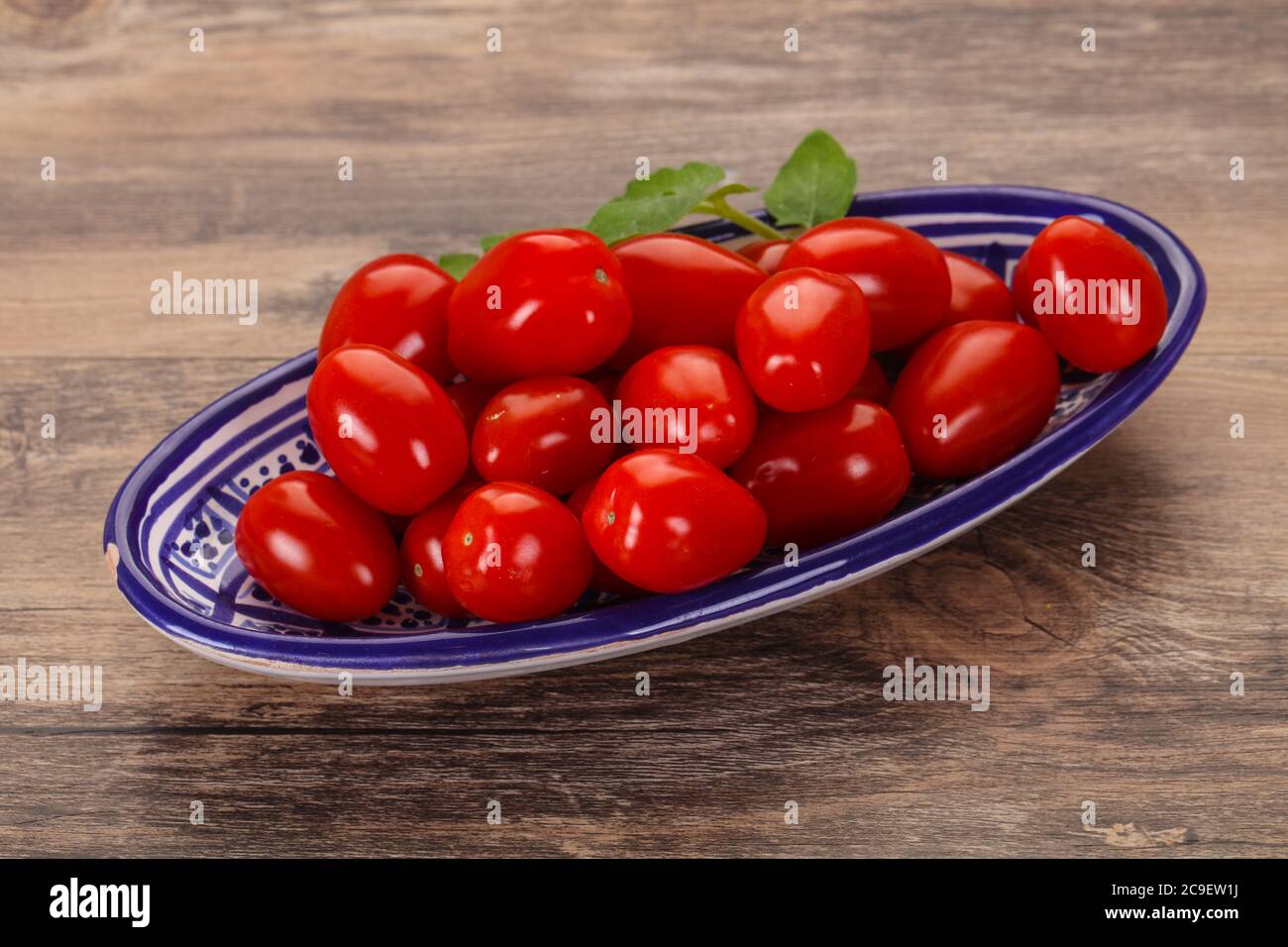 Sweet Red cherry tomatoes in the bowl Stock Photo - Alamy