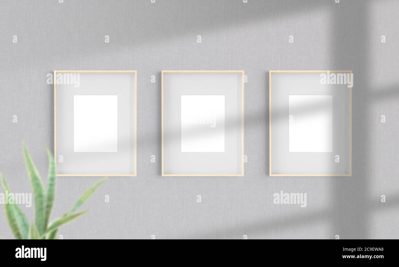 Three wooden frames on a wall mockup 3d rendering Stock Photo - Alamy