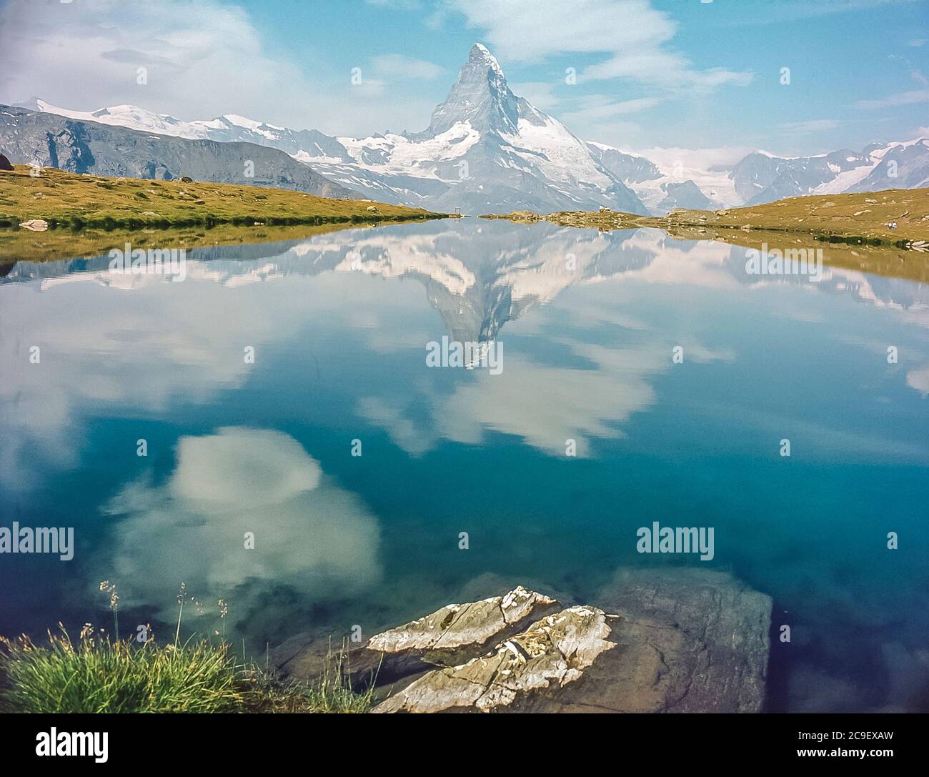 This is the famous Matterhorn mountain as seen from the alpine lake of Stelisee near the Fluhalp Hut refuge high above the Swiss mountain holiday resort town of Zermatt in the Swiss Canton of Valais as it was in 1986 Stock Photo