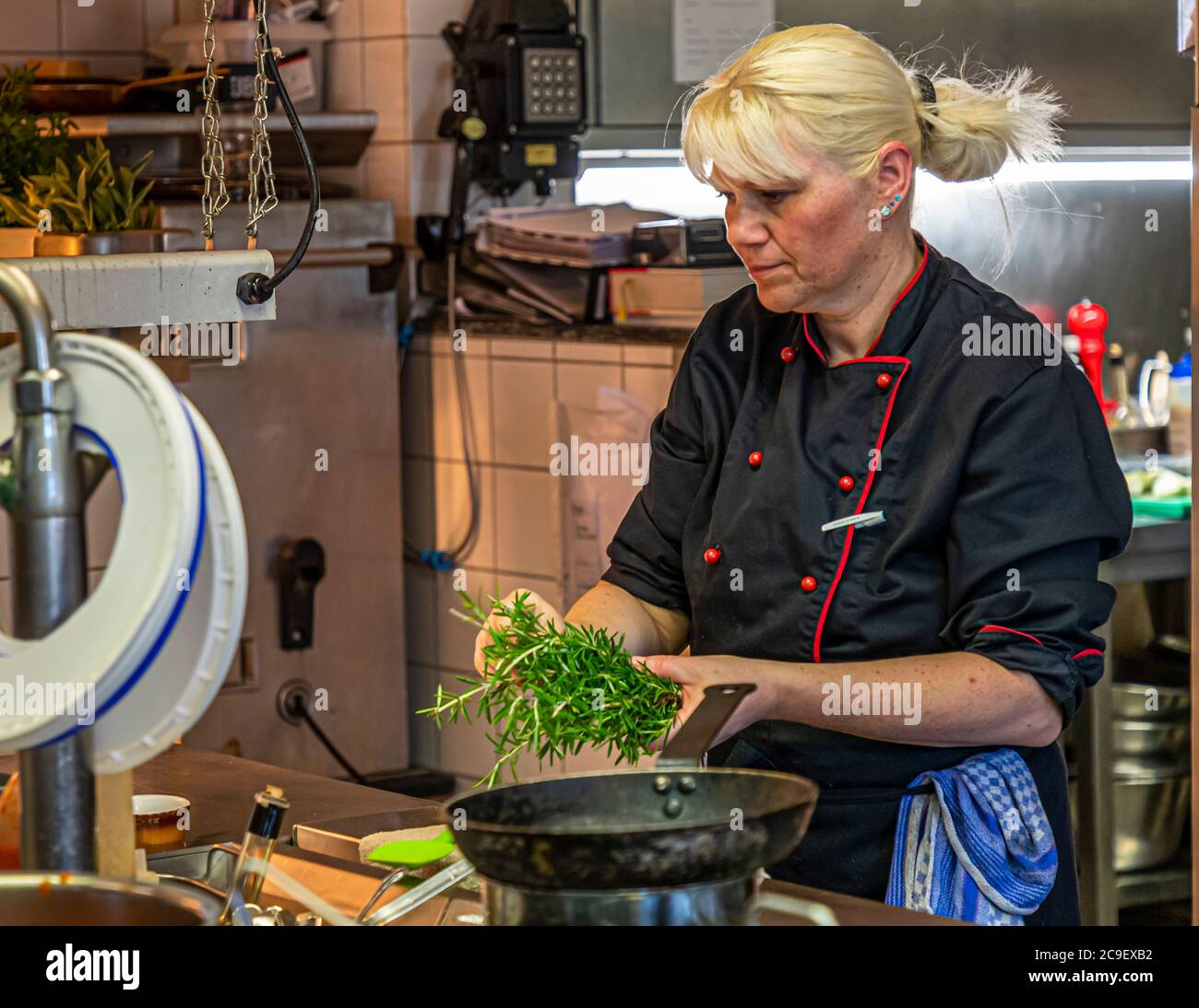 It brings Apulian cuisine to the table according to recipes also from Fabio Elia's grandmother. Chef Annette Heitzmann uses only sustainable products. Kitchen of Hotel Mühle in Binzen, Germany Stock Photo