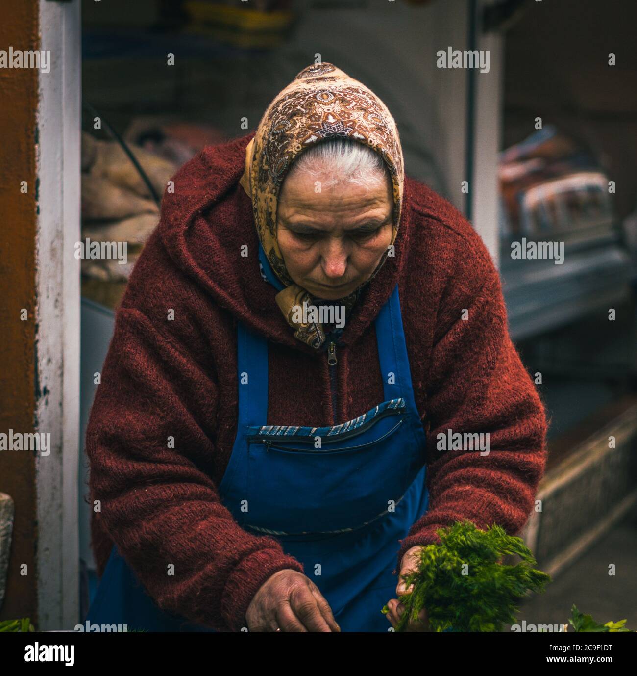 Moldavian woman in a local market at Chisinau, Moldova. Stock Photo