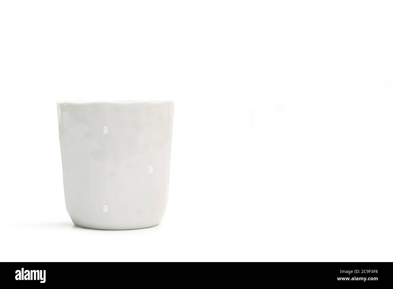 A textured white ceramic glass on a white background Stock Photo Alamy