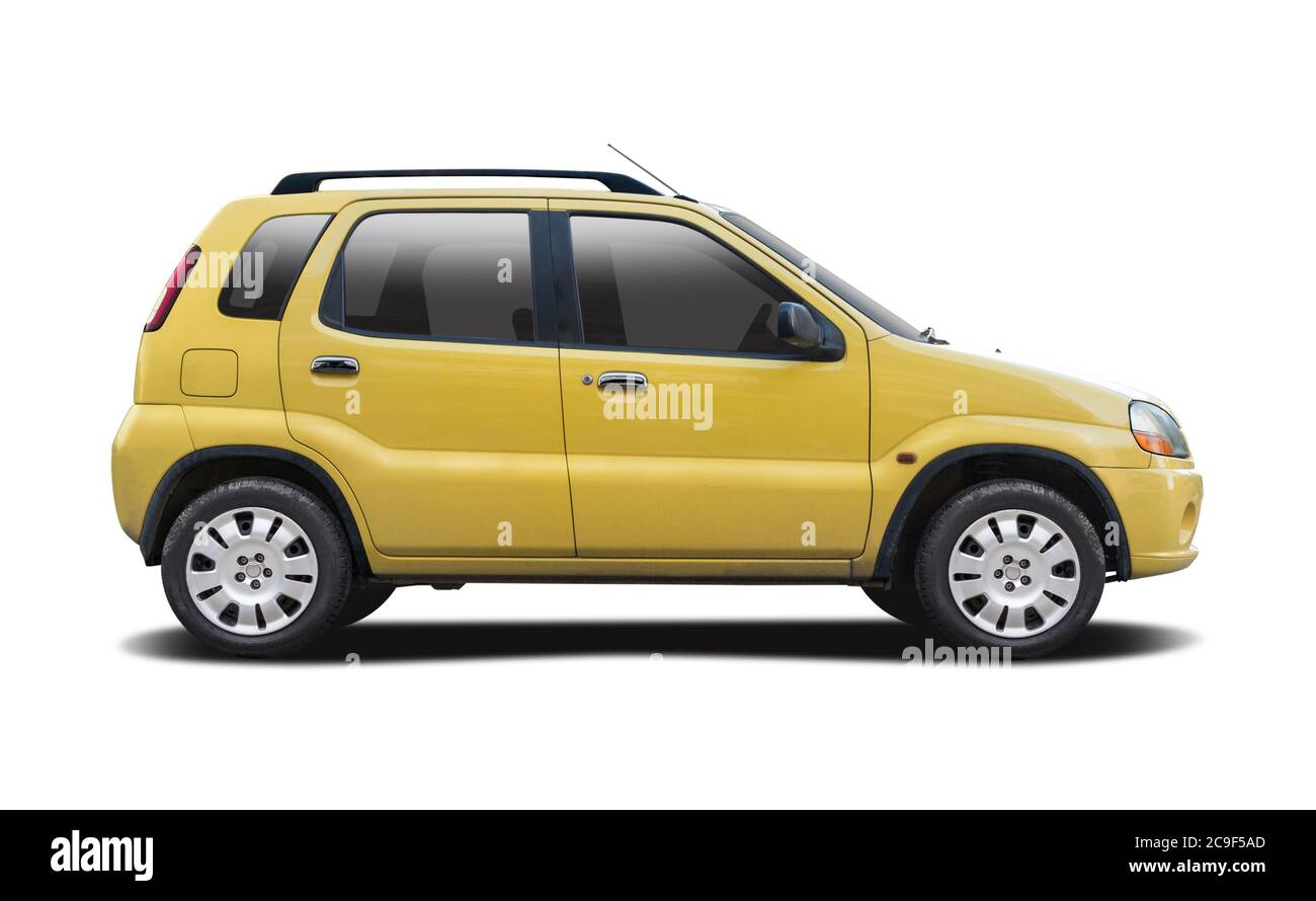 Yellow Japanese hatchback car side view isolated on white Stock Photo