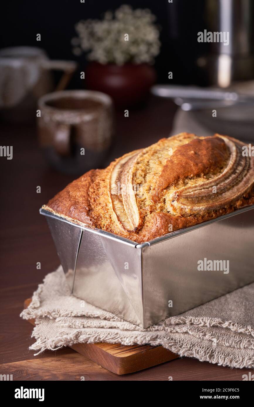Banana bread in loaf pan. Cake with banana, traditional american