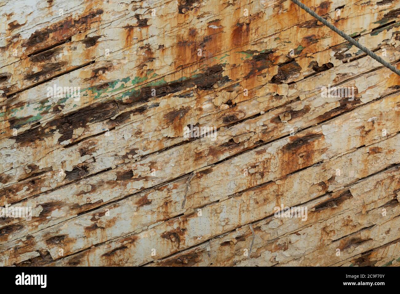 Grunge wood background with white peeling paint, from an old ship in Indonesia. Stock Photo