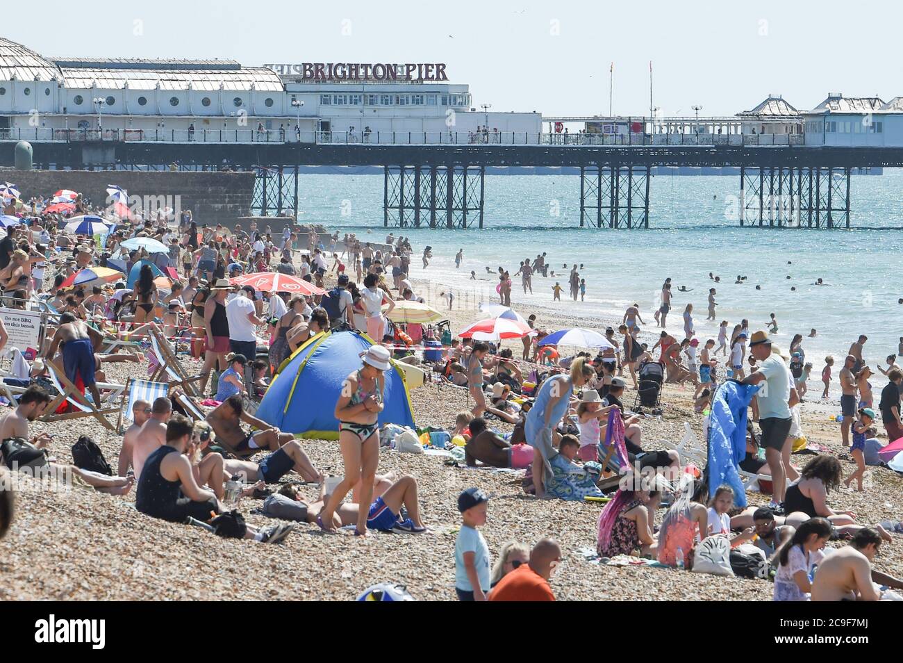 Brighton UK 31st July 2020 Crowds flock to Brighton beach today on