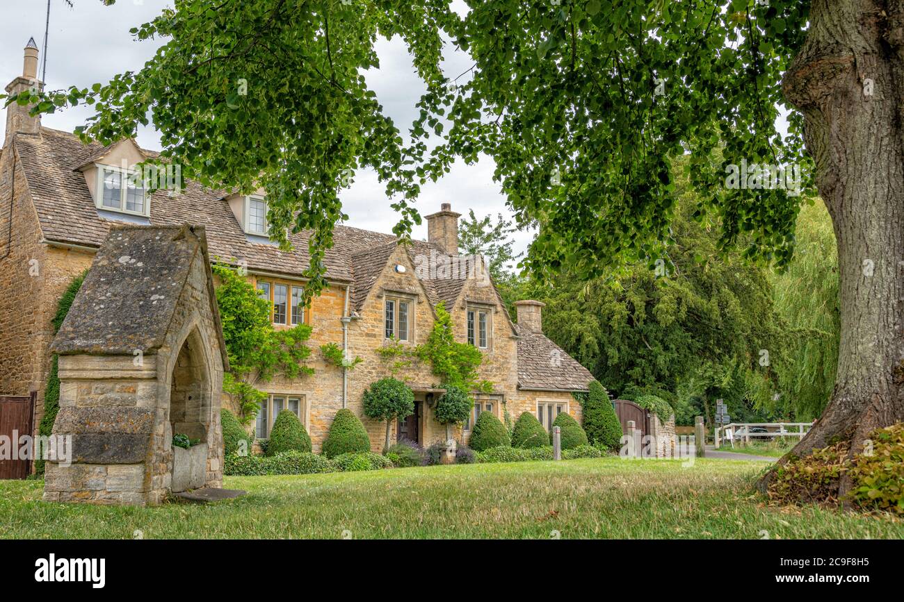 Lower Slaughter with old 18th Century drinking fountain (now disused), The Cotswolds, England, United Kingdom Stock Photo