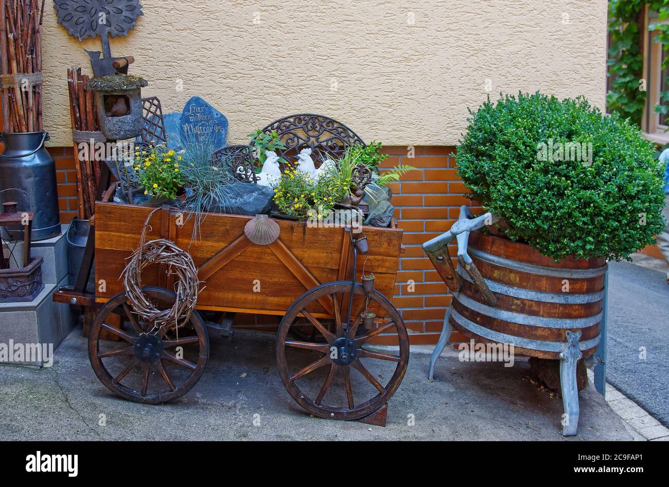 antiques, outside decorations, varied items, cart, wine barrel, flowers, sloped street, Europe, Zell; Germany Stock Photo