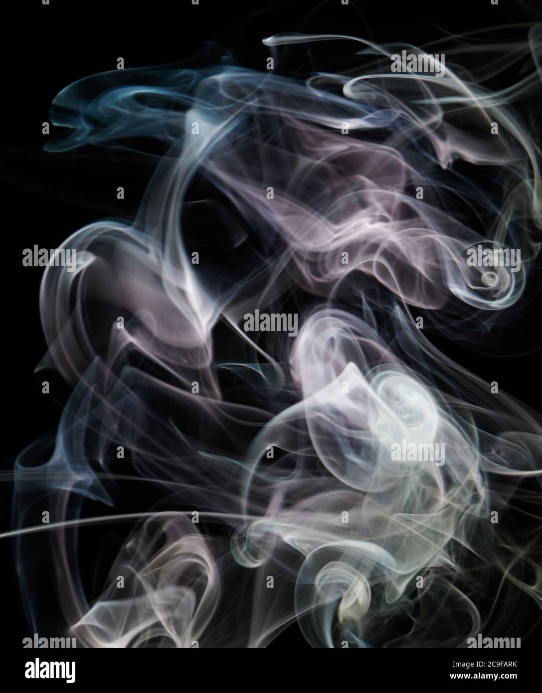 Pink smoke line shape flow on black isolated background Stock Photo