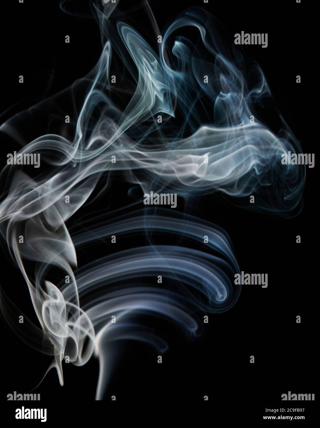 Blue smoke wave shape flow on black isolated background Stock Photo