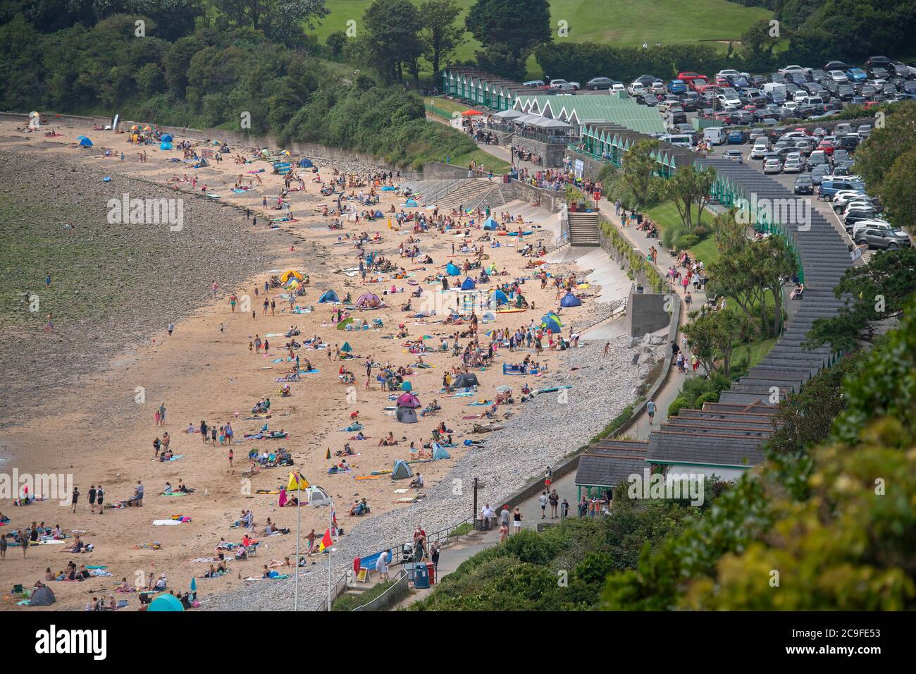 Swansea, UK. 31st July, 2020. A packed car park and beach as people make the most of the sunshine at Langland Bay near Swansea this afternoon Credit: Phil Rees/Alamy Live News Stock Photo