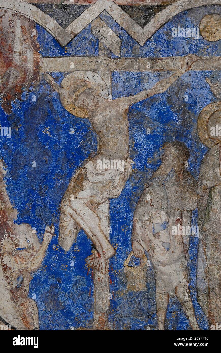 Gothic Crucifixion fresco painted in the 1500s.  In the Chapelle des fonts baptismaux, Cathédrale Saint-Pierre, at Beauvais, France. Stock Photo