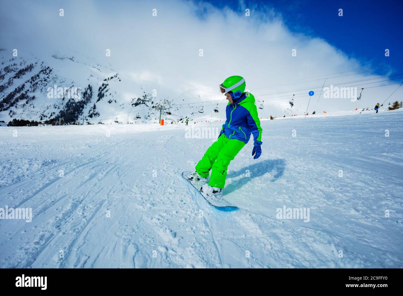 Skiers sliding down snowy slope on mountain at winter resort 11973079 Stock  Photo at Vecteezy