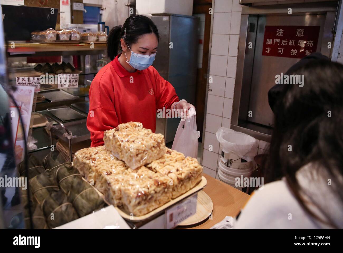 Sydney, Australia. 29th July, 2020. A customer shops at a Chinese bakery in Chinatown of Sydney, Australia, on July 29, 2020. Now, with record COVID-19 cases in the city of Melbourne and Sydney being potentially on the brink of a second wave, restaurants and bars are preparing to be hit with a return to lockdown as they struggle to survive. TO GO WITH 'Feature: Sydney's iconic Chinatown eateries adapt to life under COVID-19' Credit: Bai Xuefei/Xinhua/Alamy Live News Stock Photo