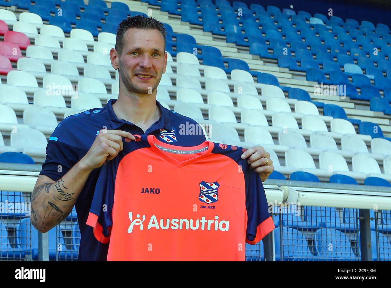 HEERENVEEN, NETHERLANDS - JULY 31: Erwin Mulder seen after his presentation as new player of SC Heerenveen posing with a shirt in the stadium on July 26, 2020 in Heerenveen, The Netherlands. Stock Photo