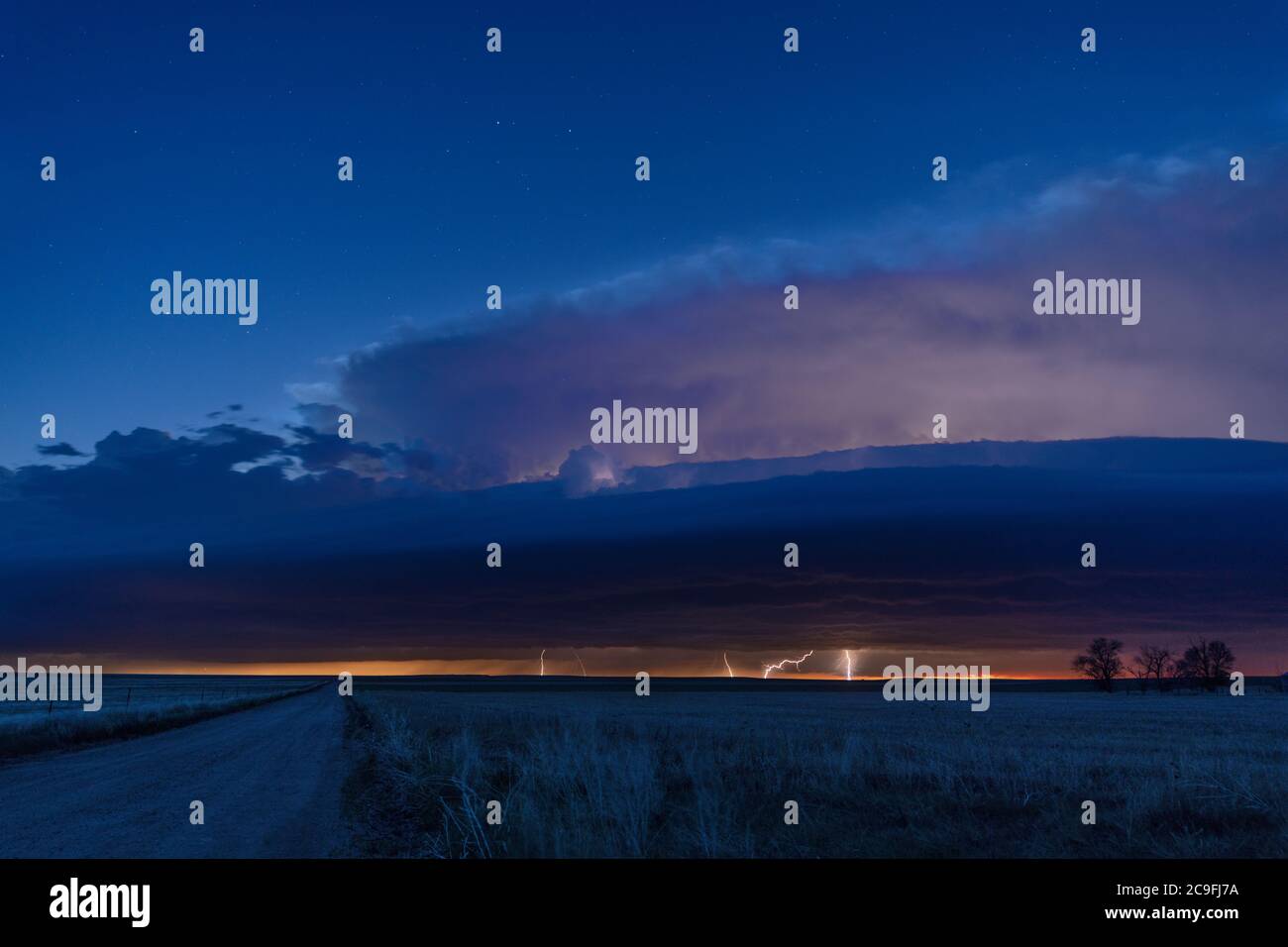 A lightning storm from a mesocyclone over the Great Plains provides a dramatic light show at night Stock Photo