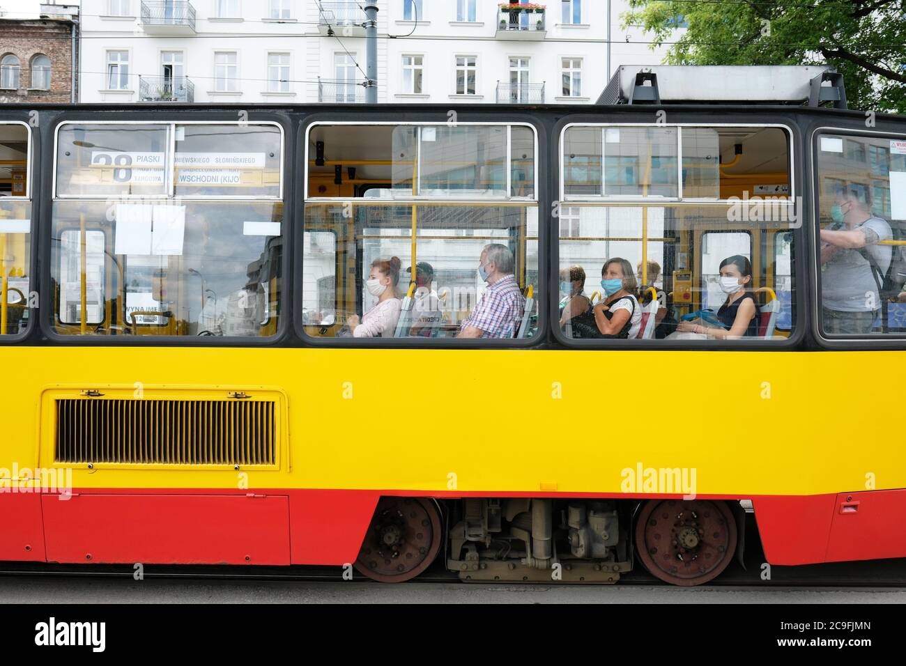Warsaw, Poland - Friday 31st July 2020 - Passengers on a city tram wear protective facemasks in the Praga district of Warsaw today as the number of new cases reported was yet another record with 657 new Coronavirus infections. There are fears that a second wave of Covid-19 is imminent. Photo Steven May / Alamy Live News Stock Photo