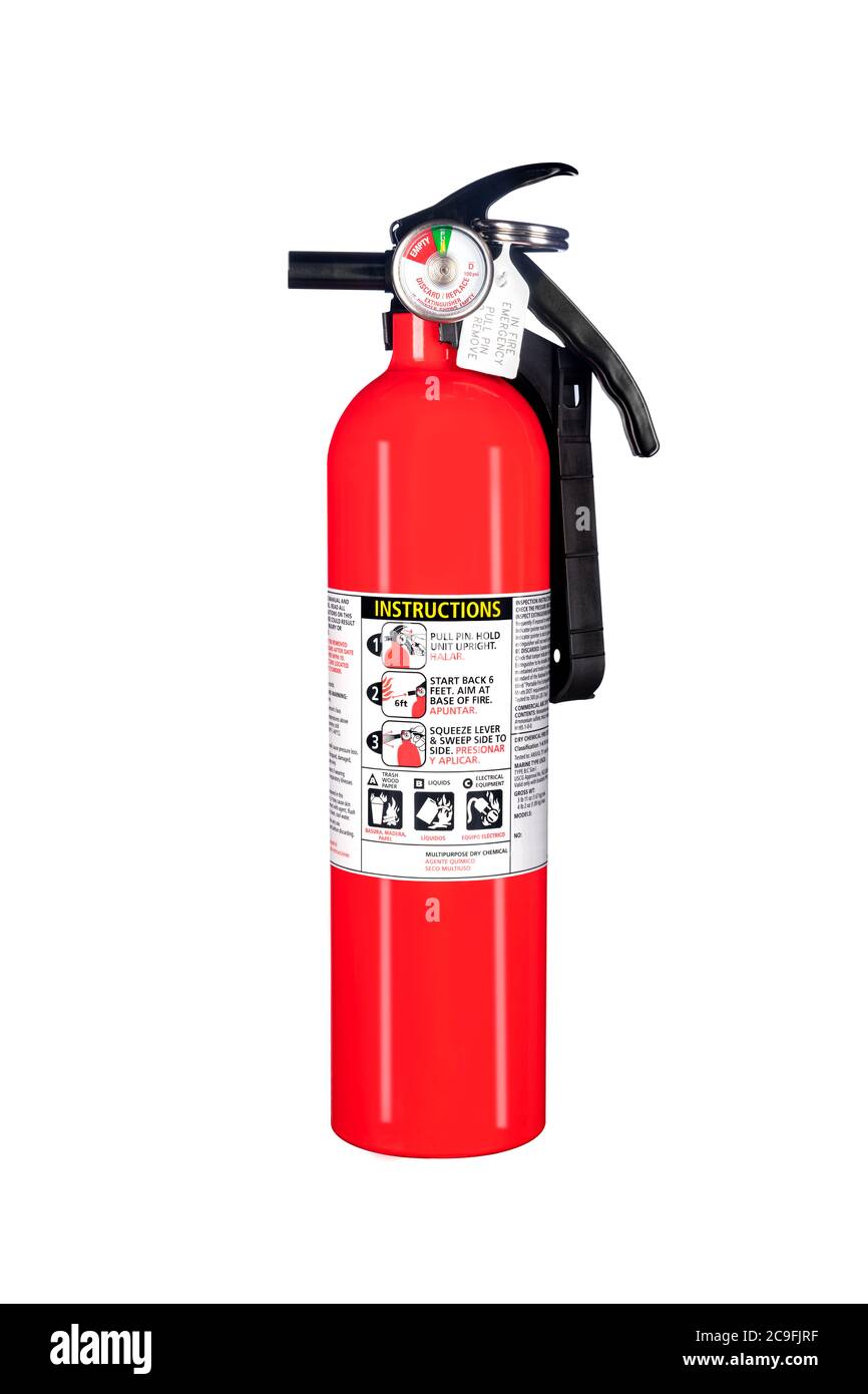 A classic red fire extinguisher isolated on white for use as a design element or safety inference for home and business protection. Stock Photo