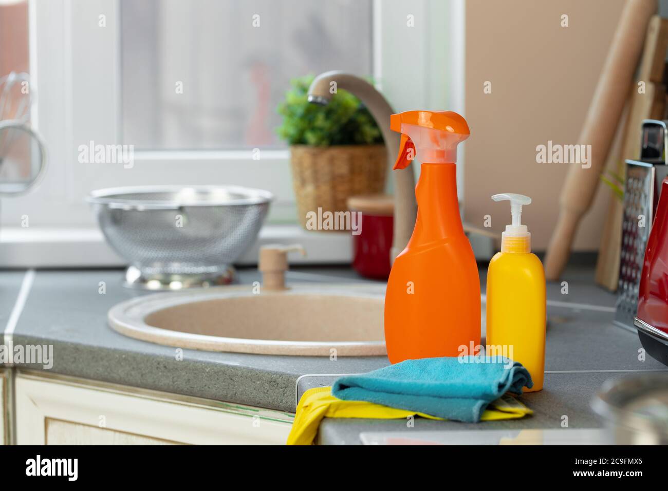 https://c8.alamy.com/comp/2C9FMX6/household-chemicals-product-bottles-standing-near-the-kitchen-sink-2C9FMX6.jpg