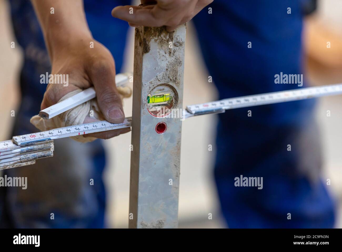 detail bricklayer with bubble level at work Stock Photo